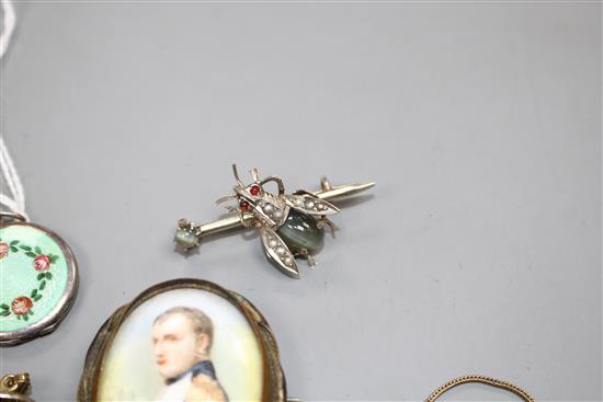 A white metal and enamel locket, a gilt metal and enamel necklace, two pendants, a brooch and 830 bug brooch, locket 24mm.